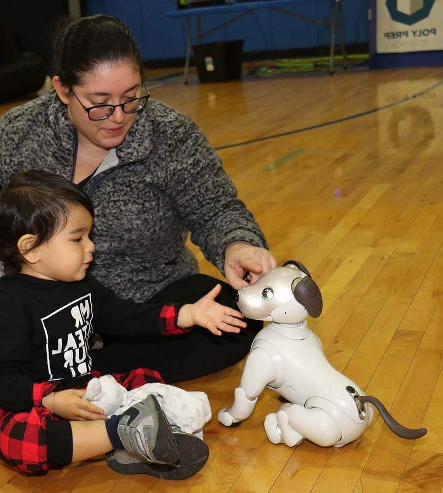 Afternoon of Tech, robot dog with child